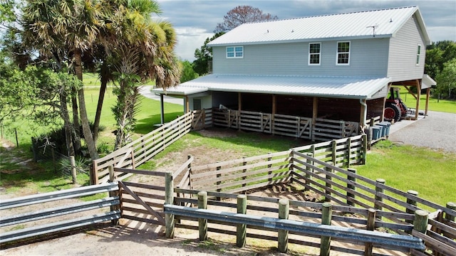 back of property with a lawn