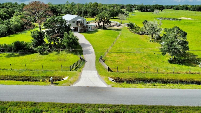 birds eye view of property with a rural view