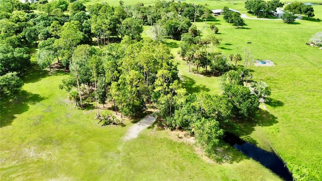 birds eye view of property featuring a rural view