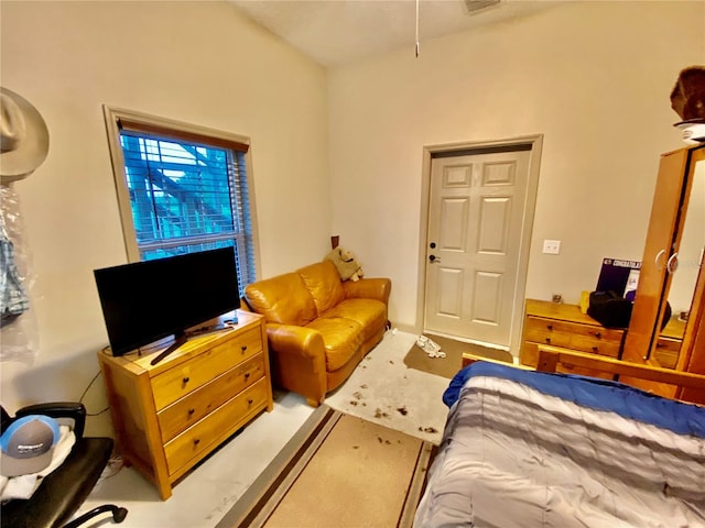 bedroom featuring light colored carpet