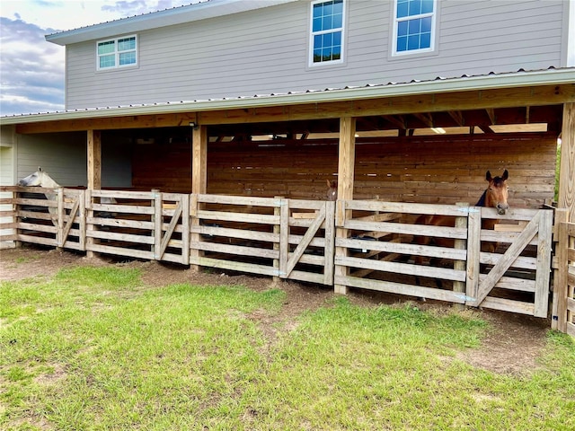 view of property exterior featuring a lawn