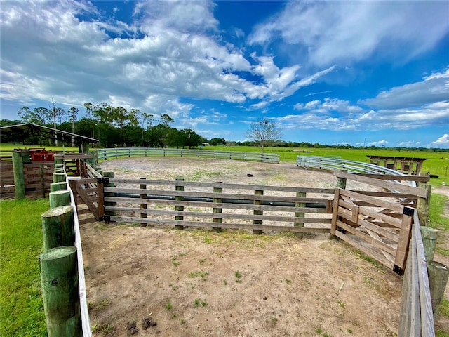 view of yard with a rural view