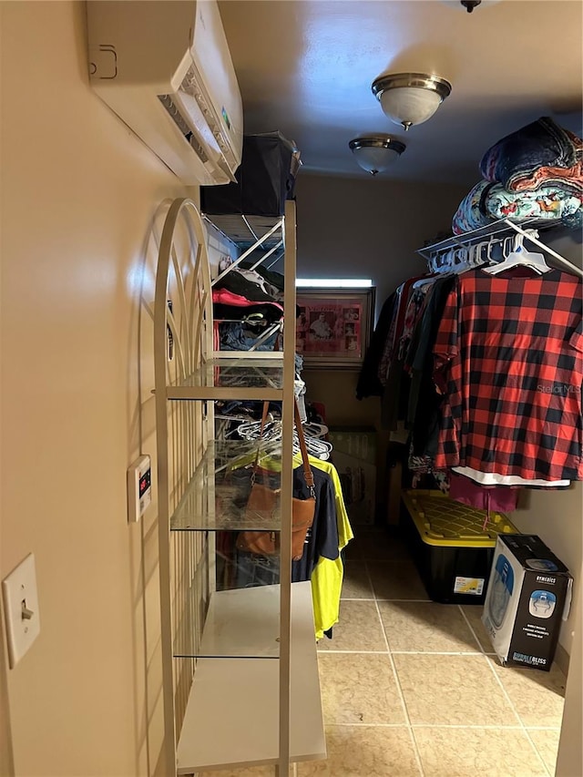 spacious closet with light tile patterned floors