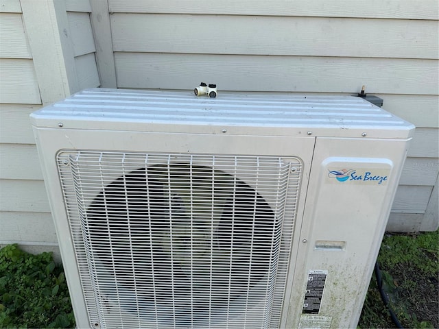 exterior details featuring wooden walls and ac unit