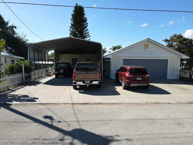 view of front facade with a garage and a carport