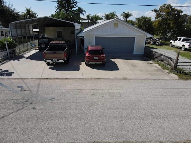 garage featuring a carport