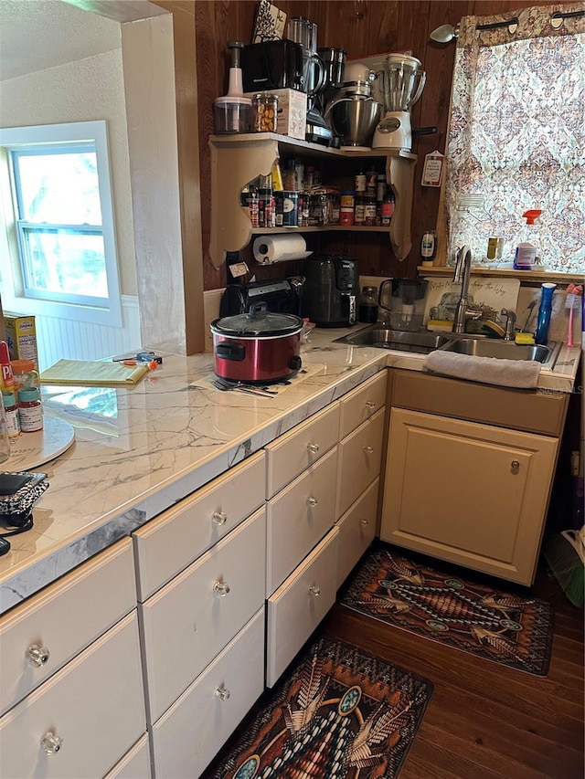 kitchen with sink, hardwood / wood-style floors, and tile countertops