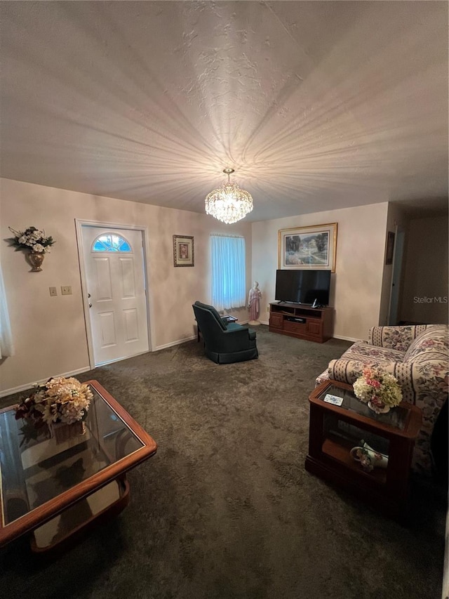 living room with a notable chandelier and dark colored carpet