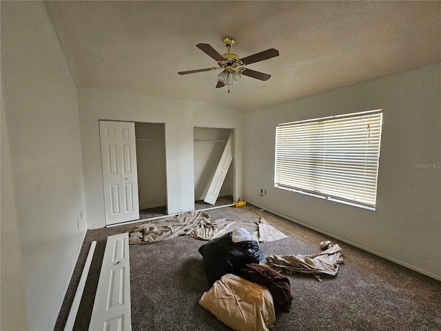 unfurnished bedroom featuring vaulted ceiling, ceiling fan, and carpet floors