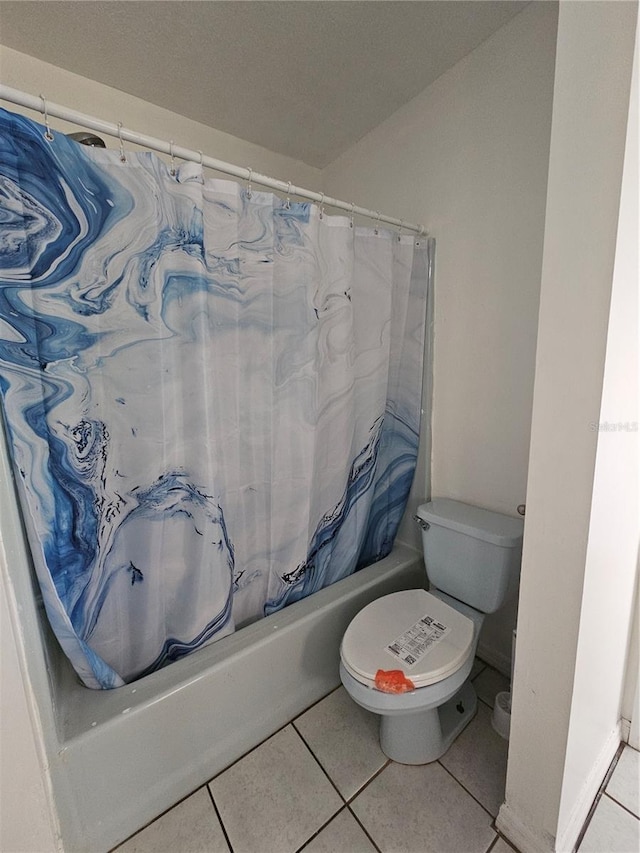 bathroom with tile flooring, shower / bath combination with curtain, and toilet