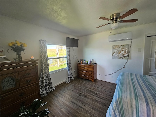 bedroom with ceiling fan, dark hardwood / wood-style floors, and a wall mounted AC