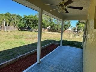 exterior space with ceiling fan