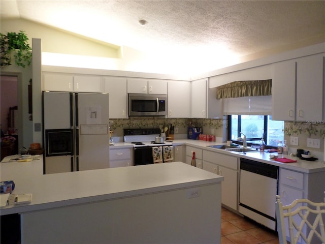 kitchen featuring white cabinetry, sink, white appliances, and tasteful backsplash