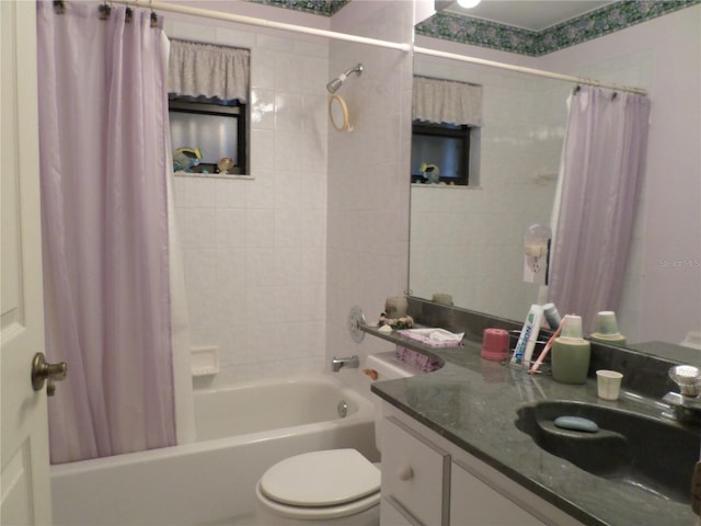 full bathroom featuring vanity, toilet, and shower / bath combo with shower curtain