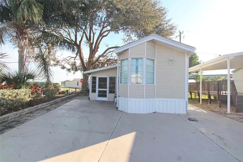 back of property with a patio