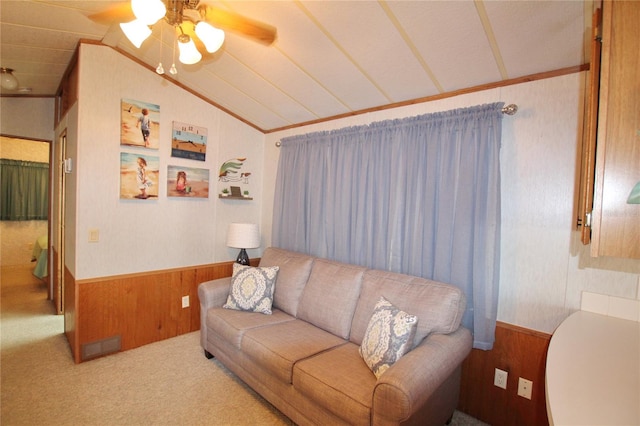 carpeted living room featuring lofted ceiling and ceiling fan