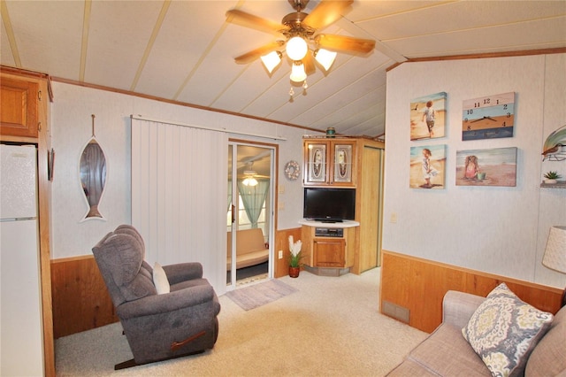 living room with lofted ceiling, light carpet, and ceiling fan