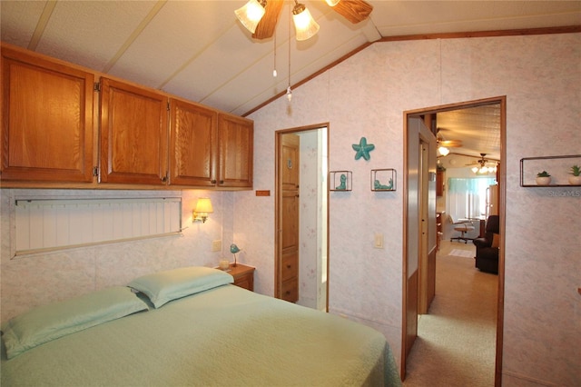 carpeted bedroom with ceiling fan and lofted ceiling