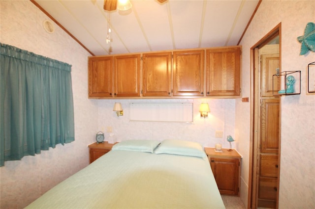 bedroom with lofted ceiling and ceiling fan