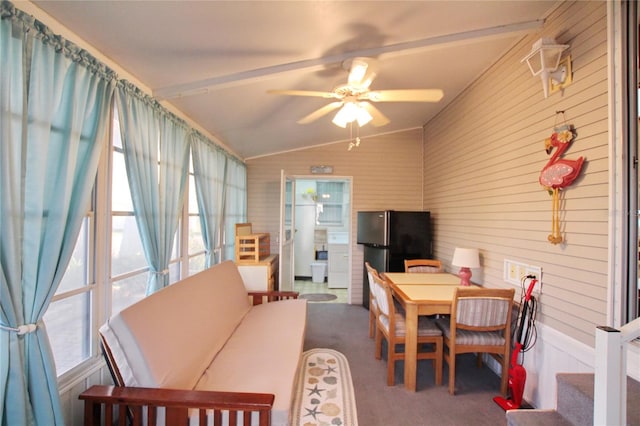 office space with carpet flooring, ceiling fan, and lofted ceiling