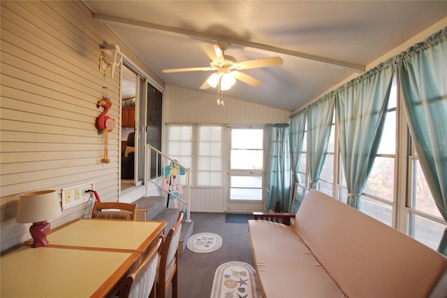 unfurnished sunroom with vaulted ceiling and ceiling fan