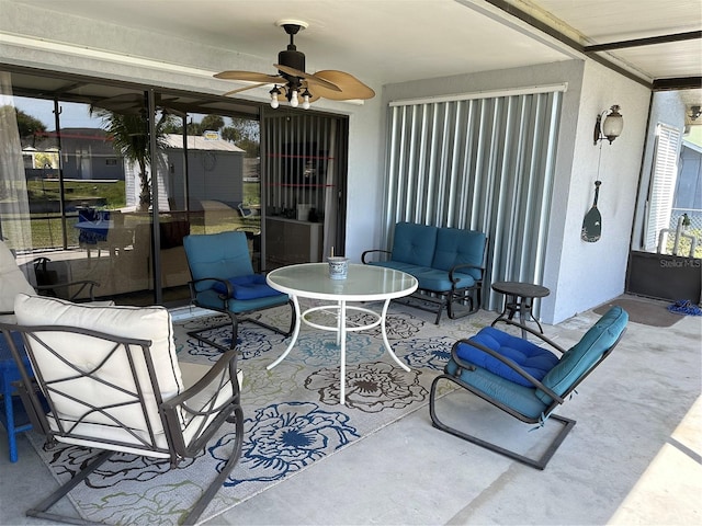 view of terrace featuring an outdoor living space, an outdoor structure, and ceiling fan