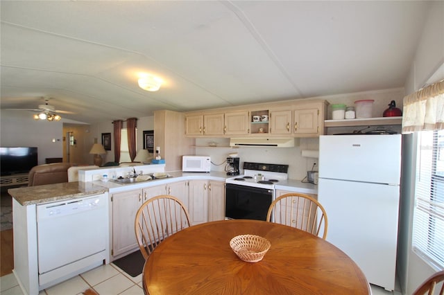 kitchen with ceiling fan, lofted ceiling, white appliances, light tile floors, and light brown cabinets