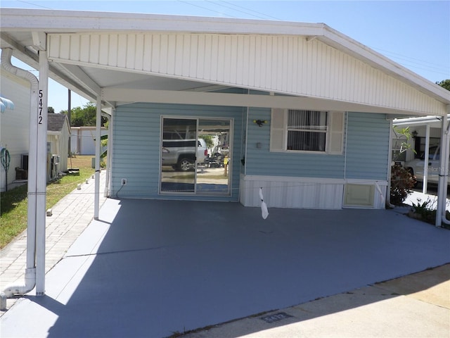 rear view of house with a carport