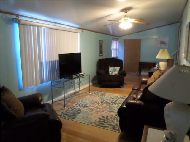 living room with vaulted ceiling, hardwood / wood-style floors, and ceiling fan