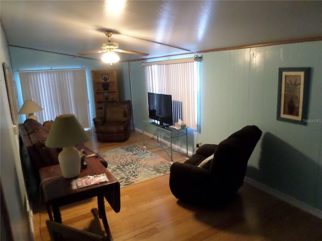 living room featuring ceiling fan and light wood-type flooring