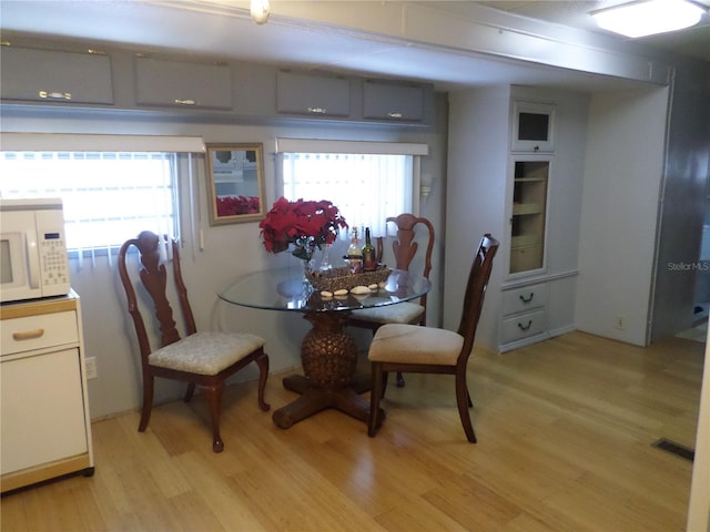 dining room featuring light wood-type flooring