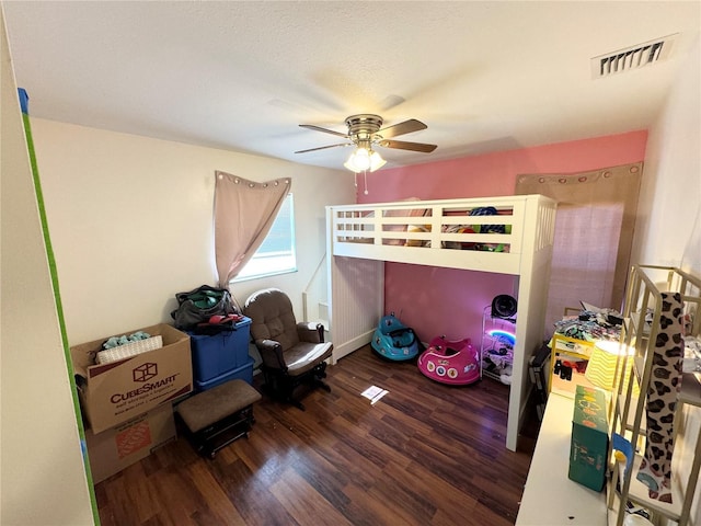 bedroom featuring ceiling fan and dark hardwood / wood-style flooring