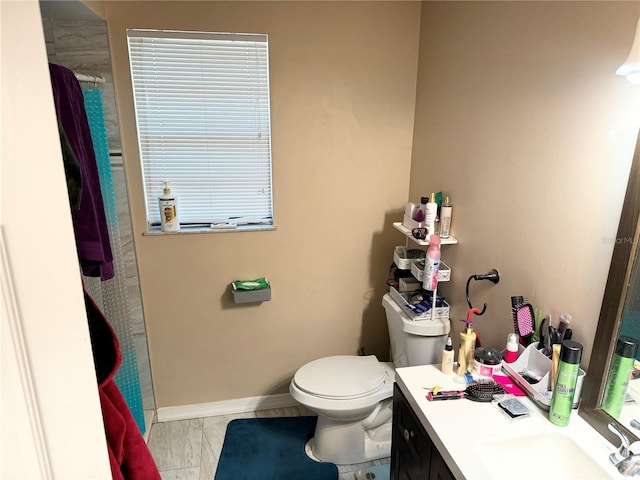 bathroom with vanity and toilet