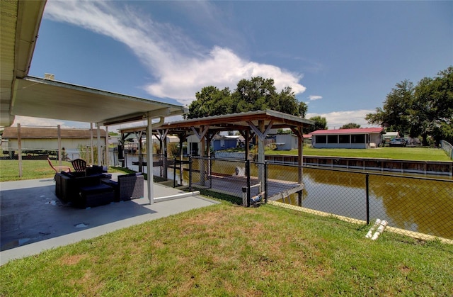 view of dock featuring a water view and a lawn