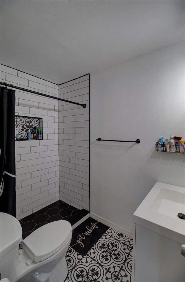 bathroom with vanity, tile patterned floors, toilet, and a shower with shower curtain