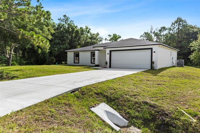 view of front facade featuring a garage and a front yard