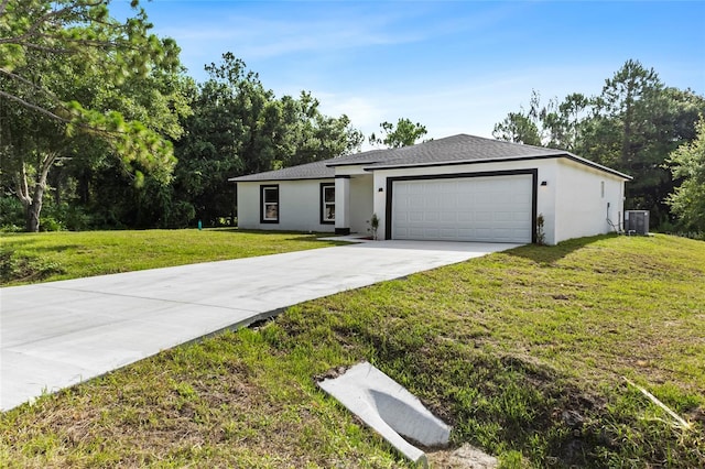 3848 NW 19th Ave, Okeechobee, FL 34972 - ranch-style house with a front yard, driveway, an attached garage, stucco siding, and central air condition unit