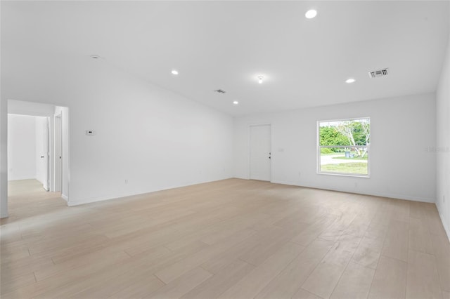 unfurnished room with light hardwood / wood-style floors