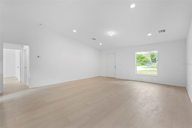 3848 NW 19th Ave, Okeechobee, FL 34972 - empty room featuring visible vents, recessed lighting, baseboards, and light wood-style floors