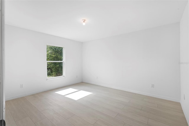 spare room featuring light hardwood / wood-style flooring