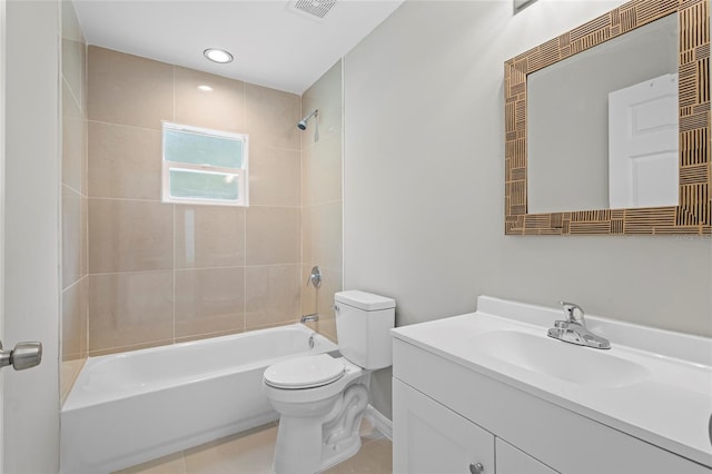 full bathroom with tile patterned flooring, tiled shower / bath combo, toilet, and vanity