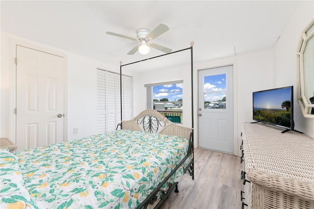 bedroom featuring ceiling fan, light hardwood / wood-style floors, and access to outside