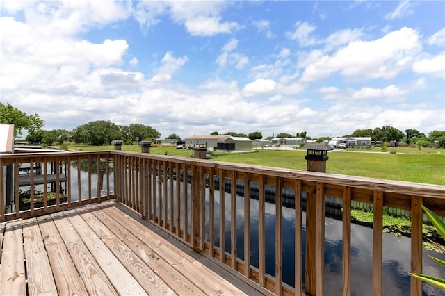 wooden terrace with a water view