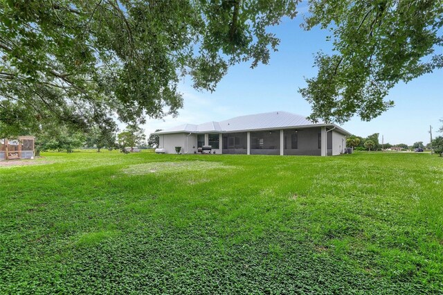 view of yard featuring a sunroom