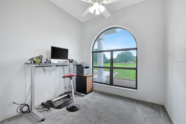 exercise area featuring lofted ceiling, light carpet, and ceiling fan