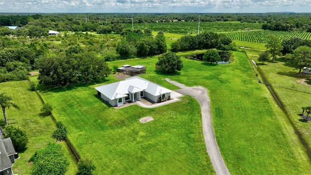 birds eye view of property with a rural view