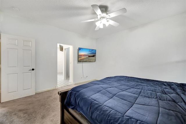 bedroom with ceiling fan, a textured ceiling, and carpet