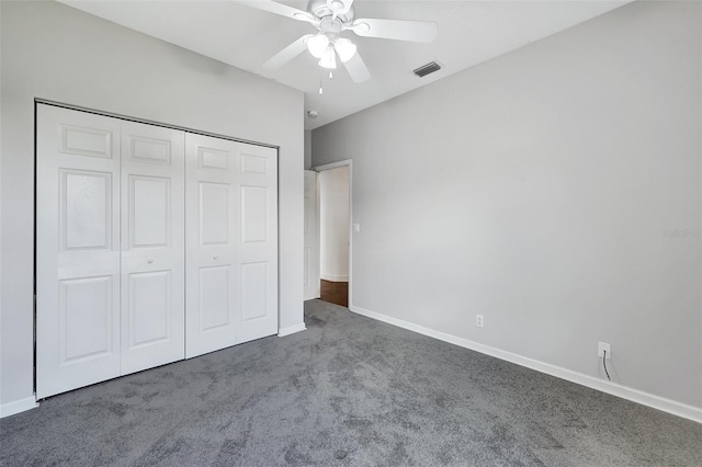 unfurnished bedroom with carpet, ceiling fan, and a closet