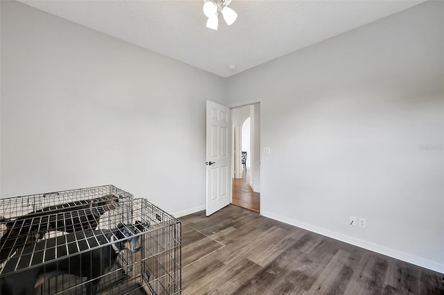 interior space featuring a textured ceiling, wood-type flooring, and ceiling fan