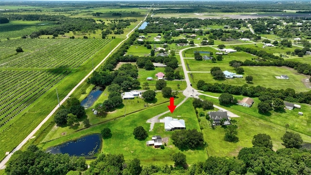 bird's eye view with a water view and a rural view